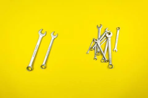 Set of wrenches of different sizes on a yellow background Stock Photos
