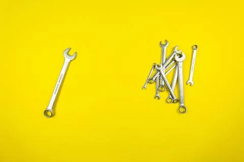 Set of wrenches of different sizes on a yellow background Stock Photos