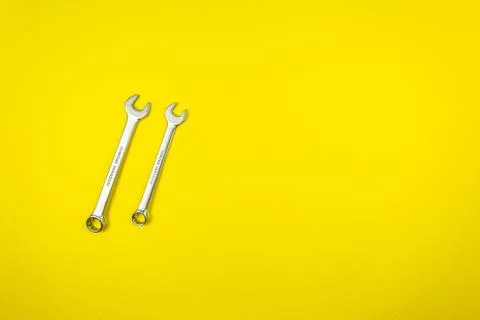 Set of wrenches of different sizes on a yellow background Stock Photos