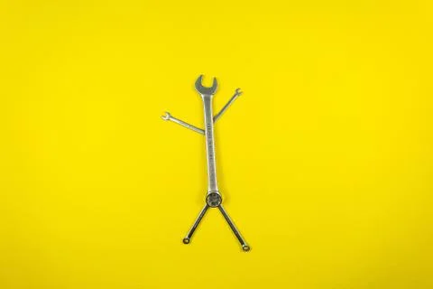 Set of wrenches of different sizes on a yellow background Stock Photos