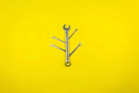 Set of wrenches of different sizes on a yellow background Stock Photos