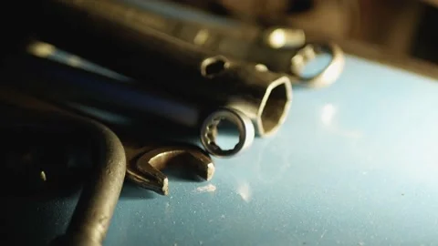 Set of Wrenches leys on blue background at night in lamp light Video stock 131406302