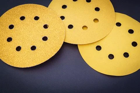 Set of yellow abrasive tools on black background Stock Photos