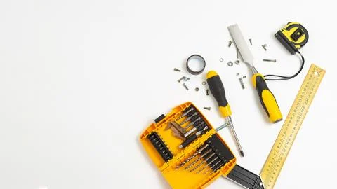 Set of yellow tools top view. men's hobby flat lay isolated on white background. Stock Photos
