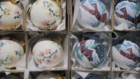 Sets of Christmas balls in gift packaging. Hand-painted tree ornaments. New year Stock Footage 305749553