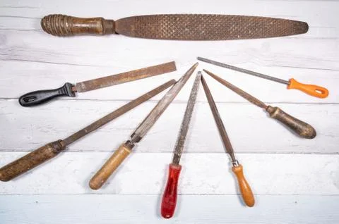 Sets of different wood rasps of different sizes in the middle of an old woode Stock Photos