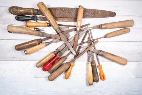 Sets of different wood rasps of different sizes and wood chisels in the middl Stock Photos