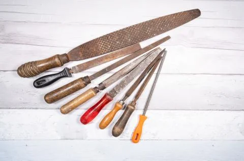 Sets of different wood rasps of different sizes in the middle of an old woode Stock Photos