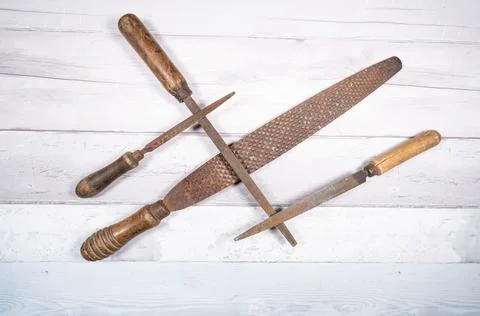 Sets of different wood rasps of different sizes in the middle of an old woode Stock Photos