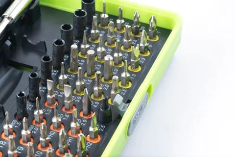 Sets of screwdriver metal bits isolated on white background. Tool set for hou Stock Photos