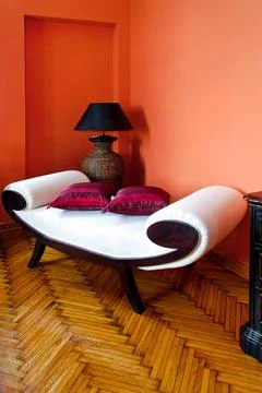 Settee White settee in orange living room interior Copyright: xZoonar.com/... Stock Photos