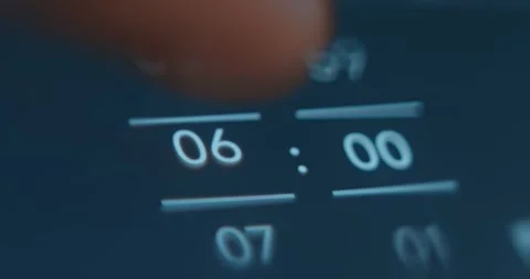 Setting alarm Clock at 6 AM on smartphone Stock Footage 322620728