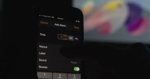 Setting alarm clock on mobil device. Open Clock App on Phone ant set alarm Stock Footage 149438913