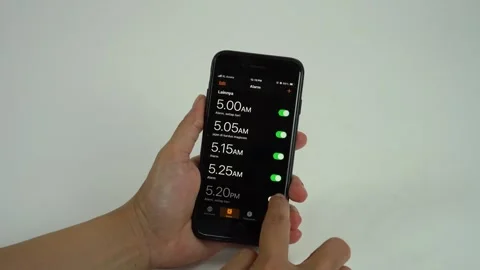 Setting alarm Stock Footage 325351195