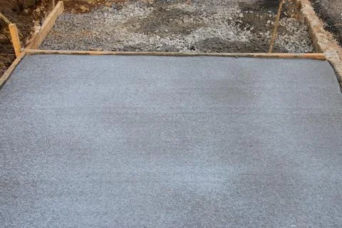Setting up for and pouring concreting a path around the house Stock Photos