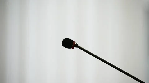 Setting up and testing a press conference microphone Stock Footage 67665981
