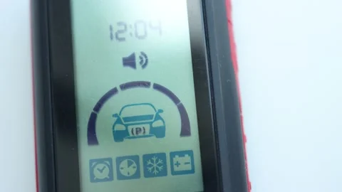 Setting and unlocking the alarm on the car alarm screen Stock Footage 137154552