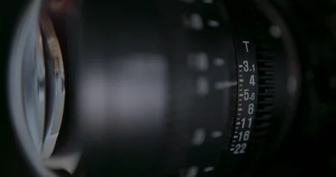 Setting the aperture on a cine lens with shallow depth of field Video stock 131028947