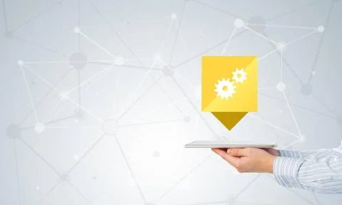 Setting application icon Hands of businessman showing tablet with gear ico... Stock Photos