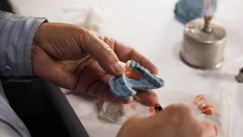 Setting of artificial teeth with dental equpments. Close up shot in 4k. Stock Footage 108007532