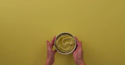 Setting avocado hummus down 1 Stock Footage 132208056