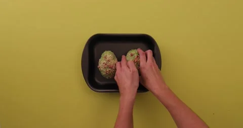 Setting avocado in a pan and picking it up 1 Stock Footage 132136641