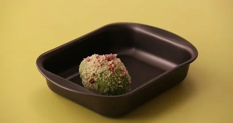 Setting avocado in a pan and picking it up 3 Video stock 132136645