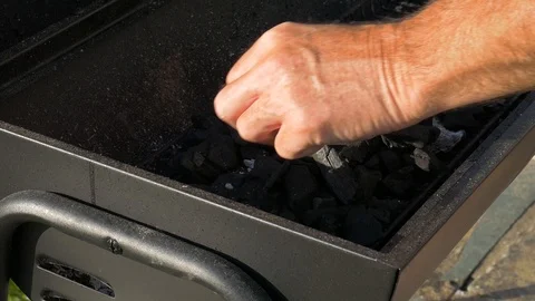 Setting up a BBQ charcoal in the summer 스톡 동영상 90551925