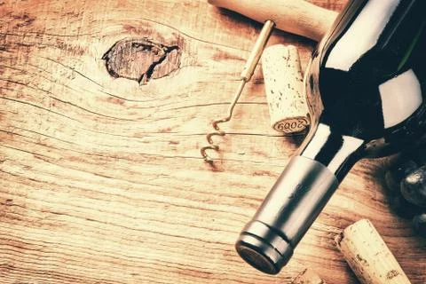 Setting with bottle of red wine and corks. Wine list concept Stock Photos