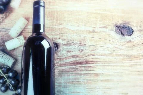 Setting with bottle of red wine, grape and corks. Wine list concept Stock Photos