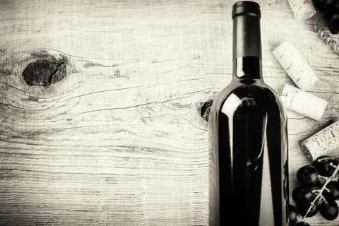 Setting with bottle of red wine, grape and corks. Wine list concept Stock Photos