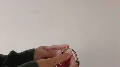 Setting the brown watch for using daily Stock Footage 150599165