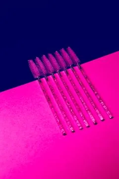Setting brushes on a pink surface for organizing and displaying tools in a .. Stock Photos