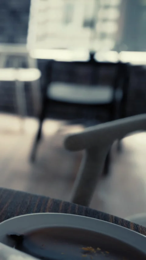 Setting in a cafe with a table and chair during daytime hours Stock Footage 339101410