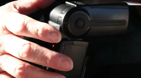 Setting up a camera flash 動画素材 10733054