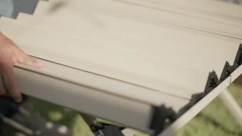 Setting Up a Camping Table in a Backyard Video stock 346534112