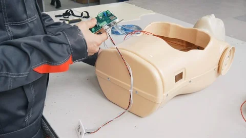 Setting up chips for an artificial robot Stock Footage 119544076