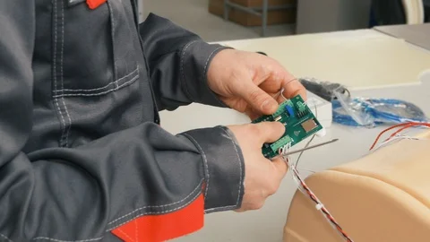 Setting up chips for an artificial robot Stock Footage 119544184