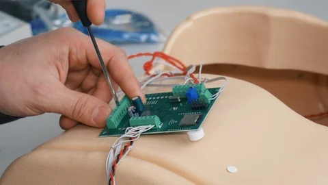 Setting up chips for an artificial robot Stock Footage 119544223