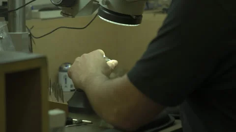 Setting up a clamp for jewellery making Stock Footage 253307521