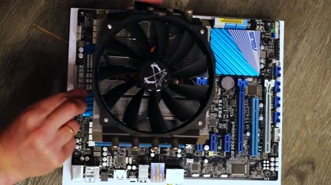 Setting up cooler to CPU processor at motherboard. 3840x2160 Video stock 66583497