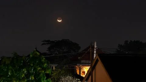 Setting Crescent Moon Over Balinese Village at Night, Time Lapse Stock Footage 175622164