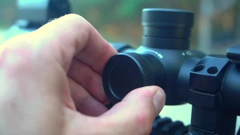 Setting up a daytime optical sight for hunting. Stock Footage 344438222