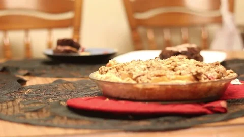 Setting Dessert on Table with Pot Holders Stock Footage 77010166