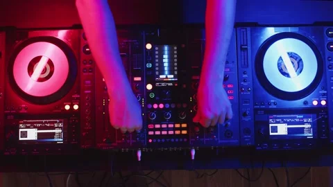 Setting up digital mixing console with hands of DJ, top view. Confident DJ sets Stock Footage 161551204