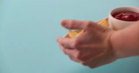 Setting down a plate of fries 3 Stock Footage 132194115