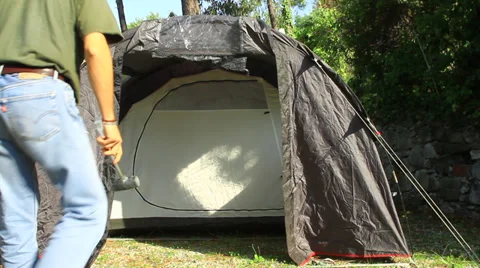 Setting down Tent at Camp Stock Footage 32374044