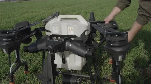 Setting up the drone before the flight over the processing of the field. Stock-Footage 188824659