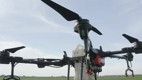 Setting up the drone before the flight over the processing of the field. Stock Footage 188824783