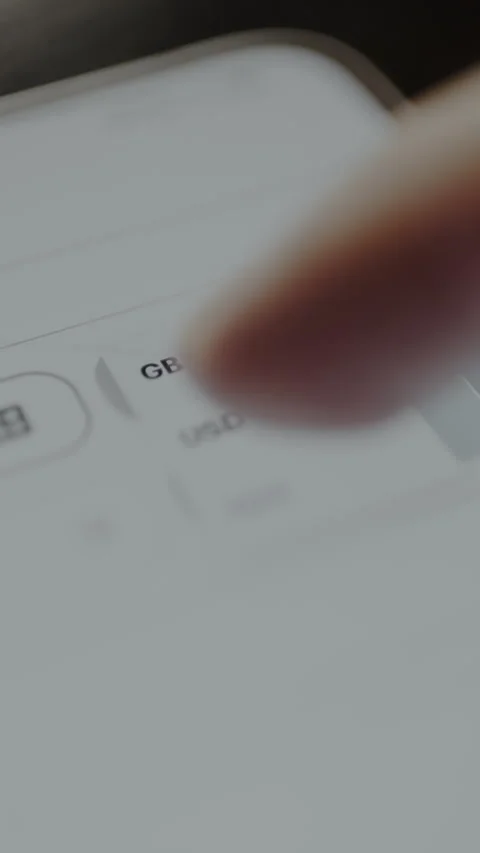 Setting the dropdown menu to USD currency within the interface of a financial Video stock 328886488